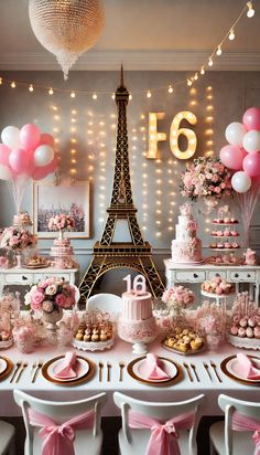 a table set up for a birthday party with pink and white decorations, balloons and cake