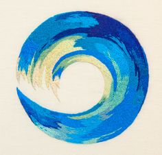 a blue and yellow circular painted with watercolors on white paper in the shape of a wave