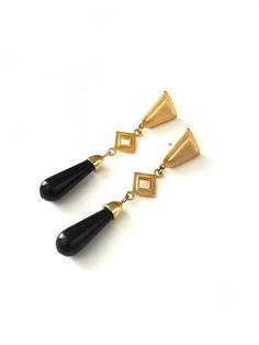 "Gorgeous Gold Tone Egyptian Revival Long Dangle Statement Earrings Beautiful earrings with great vintage inspired design. They have a gold triangular top that is softened at the corners with an open diamond shape gold connector which attaches to an \"onyx\" plastic bead. The look of the earrings is beautiful and they are very light weight bc the bead is plastic. They have a post stud back. They measure 2 3/4\" x 1/2\" Please read shop policies prior to purchase - thanks!" Elegant Triangle Earrings For Formal Occasions, Elegant Triangle Metal Earrings, Vintage Gold Teardrop Earrings For Party, Egyptian Revival, Vintage Inspired Design, Plastic Beads, Diamond Shape, Shop Policies, Diamond Shapes