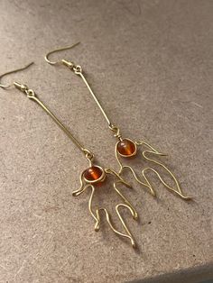 Ignite your style with these stunning fiery carnelian flame earrings, featuring vibrant orange-red carnelian gemstones set in a bold, wire-wrapped, gold-plated design. These handmade statement earrings are perfect for those who love to stand out, with a unique flame-like shape that makes them a striking addition to any jewellery collection. Whether you're dressing up for a special occasion or looking for the perfect birthday gift for her, these earrings will add warmth and elegance to any outfit Flame Earrings, Fire Earrings, Fire Jewelry, Red Carnelian, Perfect Birthday Gift, Gold Accessories, Birthday Gift For Her, Vibrant Orange, Gold Plated Earrings