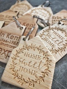 wooden keychains with engraved names on them