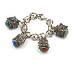 a metal bracelet with charms on it