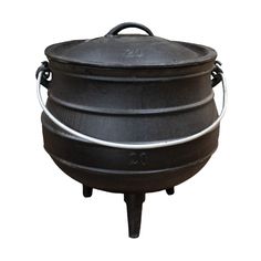 a large black pot sitting on top of a stove