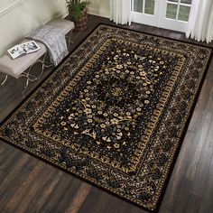 a black and gold area rug in front of a door