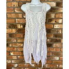 Vivid Importers Of Ny Women’s White Sleeveless Boho Crochet Swimsuit Coverup Or Top Available Sizes: Small, Medium And Large 65% Cotton 35% Polyester White Sleeveless Crochet Top With Lace Trim, White Sleeveless Vest For The Beach, Sleeveless White Vest For The Beach, Stretch Camisole Vest For Beach, White Fitted Sleeveless Crochet Top, Fitted Sleeveless Vest For Vacation, Fitted White Vest For Summer, White Sleeveless Beachwear Tank Top, Vacation Lace Trim Sleeveless Tank Top