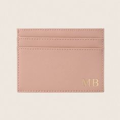 a pink card holder with the letter b on it