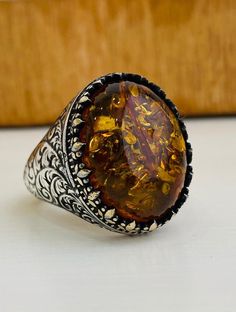 Turkish grandbazaar craftsman handmade 925 sterling silver filiy jewelry men ring with unique amber gemstone Metal: 925 sterling silver Weight: 15 g | 0.529 oz Gemstone: Amber Style: Gemstone Jewelry Men Ring, Unique Birthday Gift, Amber Gemstone, Jewelry Men, Grand Bazaar, Men Ring, Sterling Silver Filigree, Unique Birthday Gifts, Men's Jewelry Rings