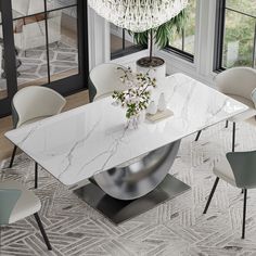 a white marble dining table surrounded by chairs