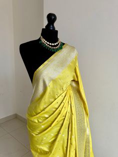 Classic and timeless Banarasi silk saree in yellow. Vibrant yellow silk saree with plain contrast blouse with border for sleeve cuffs. Rich gold zari. Perfect statement saree that's bang on trend for wedding and events. Koorai style saree for all traditional events. Rich pallu with zari and tassels, available in other colours. Blouse: plain running material with border for cuffs, unstitched Yellow Silk Pre-draped Saree With Pallu, Yellow Pre-draped Saree For Festivals, Yellow Katan Silk Pre-draped Saree, Festive Yellow Paithani Silk Pre-draped Saree, Elegant Yellow Pre-draped Saree With Traditional Drape, Elegant Yellow Pre-draped Saree With Zari Weaving, Yellow Art Silk Pre-draped Saree With Zari Work, Traditional Yellow Paithani Silk Pre-draped Saree, Yellow Saree With Unstitched Blouse For Diwali