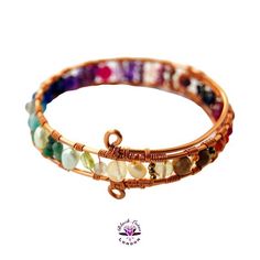 Elegant one of a kind colourful genuine gemstone wirework rainbow bangle - handcrafted with heart from the Beaux Artisan Gems by Black Lotus London Collection. ❤︎ Rainbow-hued multi gem and pearl bangle ❤︎ Secure Bangle - Made-to-order in a range of sizes ❤︎ Wearable 0.5-inch width with assorted gemstones for a bright and colourful lookChoose from copper (pictured), gold or silver plated wire work - with optional upgrade to 925 Sterling Silver on request for an additional premium. Adorn yourself Adjustable Rainbow Gemstone Bracelet, Hand Wrapped Multicolor Crystal Bracelet, Multicolor Hand Wrapped Crystal Bracelet, Rainbow Bangle Jewelry For Friendship, Rainbow Bracelet Jewelry For Healing, Adjustable Multicolor Spiritual Cuff Bracelet, Adjustable Rainbow Bangle, Multicolor Hand Wrapped Round Bead Jewelry, Handmade Multicolor Crystal Spiritual Bracelet