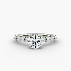 a white gold engagement ring with diamonds on the side