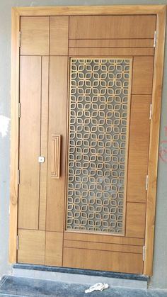 a wooden door with metal grates on it