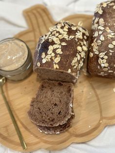 two loaves of bread on a plate with peanut butter