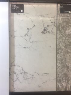 two white marble refrigerators side by side with labels on the front and back doors