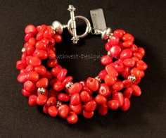 This jaunty Bracelet displays 5 strands of vibrant Bamboo Coral Petals. The Coral has been end-drilled, causing the Petals to sit at angles to each other and creating a wonderful carefree look. The Coral is beautifully shaped and finished with a silky texture. We've paired the Bamboo Coral with a variety of Sterling Silver Beads including a 7.5mm Lotus Flower Bead, 5.5mm Pumpkin Beads, and 4mm Sterling Cubes. The Sterling contrasts beautifully with the Coral and displays a subtle shine. The Brac Bracelet Displays, Pumpkin Beads, Black Pinterest, Pumpkin Bead, Bracelets And Rings, Coral Design, Bamboo Coral, Accessory Ideas, Coral Bracelet