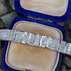 This elegant fancy link bracelet features nine (9) links each accented with five (5), channel set, princess cut diamonds and nine (9) links each accented with twenty-eight (28), invisible set, princess cut diamonds. The bracelet measures 8.2mm wide and 6 inches in length. The bracelet is finished with a hidden box clasp. Classic Princess Cut Diamond Anniversary Bracelet, Luxury Princess Cut Diamond Bracelet, Channel Set Princess Cut Jewelry Gift, Modern Platinum Princess Cut Jewelry, Platinum Princess Cut Channel Set Jewelry, Princess Cut Gold, Brilliant Diamond, Princess Cut Diamonds, Princess Cut