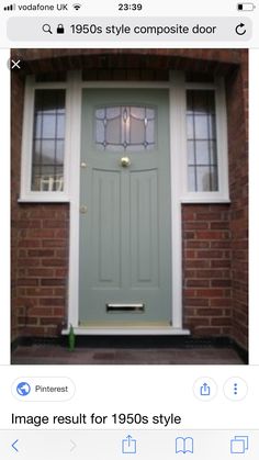 a green front door on a brick building