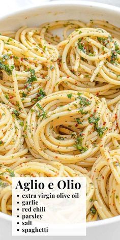 a bowl filled with pasta and garnished with parsley on top, labeled aglio e olio