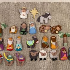 a collection of nativity figurines on the floor