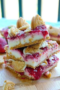 strawberry shortcakes stacked on top of each other with crackers in the background