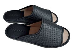 Men home slippers made of natural leather in black. These open-toe slip on sandals allow your feet to breathe freely and provide maximum comfort, and they also feature unique eyelets on the upper for an elegant look. Additionally, in the heel area there is a leather insert with foam, which guarantees comfort and stability, preventing slipping and acting as a shock absorber, protecting the feet against injuries while walking. The sole is made of EVA foam, which increases the comfort of wearing th Black Leather Slippers With Removable Insole, Black Slide Mules With Removable Insole, Black Open Toe Slippers With Leather Sole, Comfortable Black Leather Slippers, Comfortable Black Slippers With Leather Sole, Black Leather Sole Slide Slippers, Black Open Toe Slippers With Leather Footbed, Black Open Toe Slides With Leather Footbed, Comfortable Black Leather Sandals