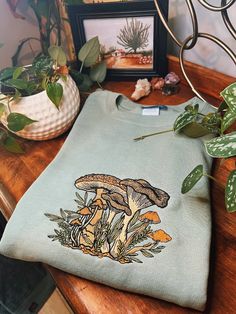 Sage Fungi Foliage Embroidered Crewneck Unisex Embroidered - Etsy Cotton Fall Sweatshirt With Mushroom Print, Cotton Sweatshirt With Mushroom Print For Fall, Earthcore Aesthetic, Goblincore Cottage, Goblincore Outfits, Current Aesthetic, Cottagecore Indie, Teen Outfits, Casual Outfit Inspiration