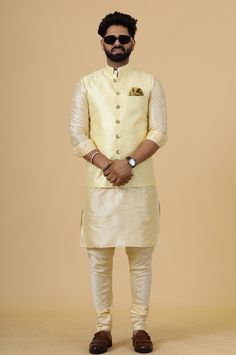 Important Instructions: We request you to kindly calculate the processing time of your order  after the mutual confirmation on Bespoke measurements between us has taken place (either via message , e mail or form) "Crafted with Passion in India; loved by men across the USA, Canada, Europe" Product Specifications : Material: Banarasi Silk Color: Light Yellow Jacket with Cream Kurta Pajama Collar type: Mandarin Jawahar Jacket With 6 Buttons in Front Package contents: 1 Half Jodhpuri Jacket + 1 Kurt Embroidered Gold Bandhgala For Navratri, Festive Nehru Jacket With Gota Work And Traditional Drape, Festive Chanderi Nehru Jacket With Gota Work, Eid Nehru Jacket With Gota Work In Chanderi, Eid Chanderi Nehru Jacket With Gota Work, Chanderi Nehru Jacket With Zari Work For Eid, Diwali Nehru Jacket With Gota Work, Navratri Chanderi Nehru Jacket With Cutdana, Fitted Bandhgala For Puja During Eid