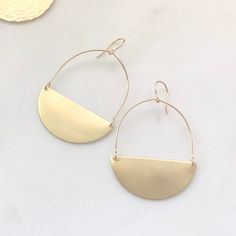 Minimalist Yellow Gold Earrings With Moon Charm, Modern Semi-circle Earrings For Everyday, Modern Semi-circle Earrings For Everyday Wear, Minimalist Half Moon Earrings For Everyday, Minimalist Yellow Gold Crescent Earrings, Minimalist Crescent Yellow Gold Earrings, Modern Crescent Brass Hoop Earrings, Gold Minimalist Hoop Earrings With Moon Charm, Minimalist Half Moon Earrings For Gift