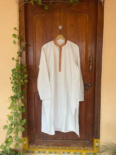 pure silk paithani mens kurta/mens kurta set/cream mens kurta /white mens kurta/Indian mens wear/chikankari kurta/groom wedding indian kurta/cream wedding kurta/paithani kurta     Well..!! we understand that you may not get in your desired size/pattern, here you go with customization according to your size/pattern which we can deliver in 1-2 weeks of time period !!      Here is a beautiful chikankari mens kurta with paithani border highlights as shown !!this Kurtas can be customized in colors and patterns and sizes !! comes with matching pants!!Please message us for any customization !!  Fabric : pure chikankari silk ( design may vary acc to availability ) Lining : no  Closure : front open with buttons  kurta length: 45 inch approximately       please note that the item might ships from US Designer Straight Kurta In Off White, Fitted White Cotton Silk Kurta, White Fitted Cotton Silk Kurta, Off White Straight Kurta For Transitional Season, Off White Straight Kurta, White Chanderi Long Sleeve Sherwani, Off White Chanderi Kurta With Long Sleeves, White Cotton Silk Sherwani With Dabka, Off White Long Sleeve Chanderi Kurta