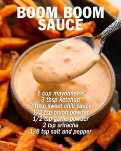 a spoon full of dipping sauce on top of sweet potato fries