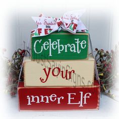 a stack of wooden blocks with the words celebrate your inner elf written on them