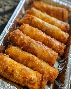 some fried food is sitting in a metal tray