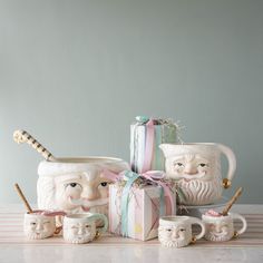 a group of ceramic figurines sitting on top of a table