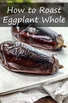 two eggplant halves on a baking sheet with the title how to roast an eggplant whole