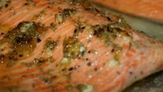 a piece of salmon with seasoning on it