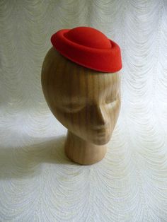 "Molded faux felt pillbox style fascinator hat base in pretty lipstick red that measures 6.5\" x 5.5\" - and has a contoured shape to fit on the head. Low side is approximately .75\" and the higher side is approximately 1.5\". Just attach an alligator clip inside or an elastic to make this a breeze to wear. A cute little base ready for your next DIY millinery project. Easy to decorate with many of the flowers and leaves available in my shop! (PLEASE NOTE this is a FASCINATOR SIZE HAT BASE not a Adjustable Red Felt Hat For Formal Occasions, Red Adjustable Felt Hat For Formal Occasions, Classic Red Felt Hat For Formal Occasions, Red Fitted Felt Hat For Formal Occasions, Red Fitted Top Hat For Winter, Red Brimmed Felt Hat For Formal Occasions, Formal Red Fitted Felt Hat, Red Fitted Mini Hats For Winter, Red Felt Hat With Curved Brim For Formal Occasions