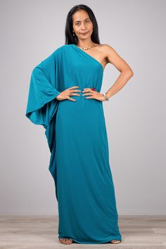 "One shoulder dress, Long teal dress, Off shoulder evening dress PRODUCT SIZE : Free Size * Chest : 40\" will stretch to 44\" * Waist : 40\" will stretch to 42\" * Hips : 40\" will stretch to 42\" * Sleeve length : 23\" * Length : 57\" - 58\" from shoulder to hem (measured when laying flat) If your chest measurement is below 34\", the dress will be too big for you MATERIAL : * Polyester spandex \" Venetia\" > soft and comfortable to wear NOTE : * Model chest : 32\", waist : 24\" hips : 35\" * Elegant Blue Draped One-shoulder Dress, Elegant Blue Draped One Shoulder Dress, One Shoulder Maxi Dress For Evening, Blue One-shoulder Dress With Asymmetrical Neckline For Evening, Blue One Shoulder Dress With Asymmetrical Neckline For Evening, Turquoise Evening Dress For Party, Green One-shoulder Maxi Dress For Evening, Summer Prom One Shoulder Draped Dress, Summer Prom One-shoulder Draped Dress