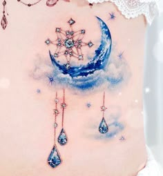 a woman's stomach with an image of a crescent moon and stars on it