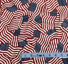 an american flag pattern with stars and stripes on red, white, and blue fabric