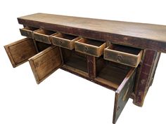 an old wooden desk with several drawers