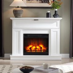 a living room with a fire place in the center and a painting on the wall