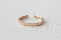 14K rose gold slightly tapered half eternity cuff ring set with round brilliant cut diamonds weighing 0.12 ct (G/VS2,SI1). 2.1 mm band, available in all sizes. Also available in 14K white or yellow gold, 18K (any color), platinum and palladium. Please send us an email for these options. *Made to order *SKU 16-101473 Diamond Cuff Ring, Cuff Ring, Full Eternity Ring, Three Rings, Cuff Rings, Round Brilliant Cut Diamond, Brilliant Cut Diamond, Pave Diamonds, Round Brilliant