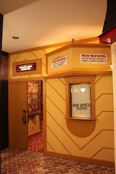 the entrance to an office building with signs on it's walls and door way