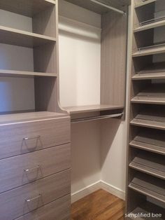 an empty walk in closet with shelves and drawers