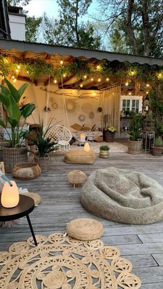 an outdoor patio with seating and lights