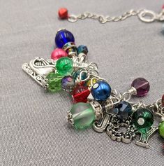 "- Old Fashioned Christmas Charm Bracelet Chain is adjustable from 7\" - 9\" with a lobster claw closure and extension chain The bracelet links are filled with a rainbow of glass and gem stone beads and crystals - really pretty. Mixed between the beads and gemstones are vintage Christmas themed charms and tiny jingle bells. This makes a great gift or the perfect holiday accessory for yourself! Your bracelet will be carefully gift packaged and shipped via USPS First Class Mail. Feel free to conta Christmas Memories, Old Fashioned Christmas, Bracelet Chain, Christmas Charms, Christmas Memory, Holiday Jewelry, Gem Stone, Jingle Bells, Charm Bracelets