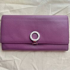 Euc Bvlgari Bulgari Grain Calfskin Leather Long Card Wallet Silver Metal Clip Lavender Purple Leather Women Long Wallet Approximately: 4 In X 7.5 In X 0.80 In 10 Card Slots Change Coin Zipper Compartment 1 Billfold Checkbook Compartment Slight Rubbing On Edges * Slight Coin Residue * Please See All Pictures No Dust Bag Or Box Elegant Purple Wallets For Travel, Elegant Purple Wallet For Gift, Bvlgari Bags, Purple Leather, Lavender Purple, Long Wallet, Card Wallet, Continental Wallet, Color Purple