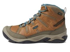 a brown shoe with blue laces on the outstep and side zippers