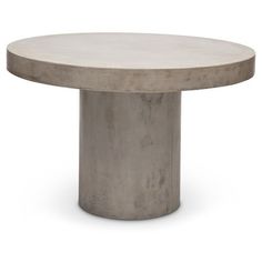 the concrete table is round and has a circular base with an oval design on it