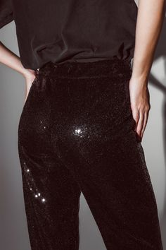 Elevate your party attire with our Straight Leg Sequin Pants in elegant black, perfect for any occasion. These wide-leg pants are designed to make a statement, offering a stylish look that complements all body types.    With a maxi length and standard fit, these pants provide a classic and versatile style. The straight leg cut ensures an elegant and timeless look, while the sequins add a touch of glamour to your ensemble. These pants are both fashionable and functional, equipped with side pocke Black Sequin Pants, Tan Scarf, Sequin Pants, Party Pants, Chic Blouses, Pants Fit, Knitwear Tops, Black Sequins, Hat Hairstyles